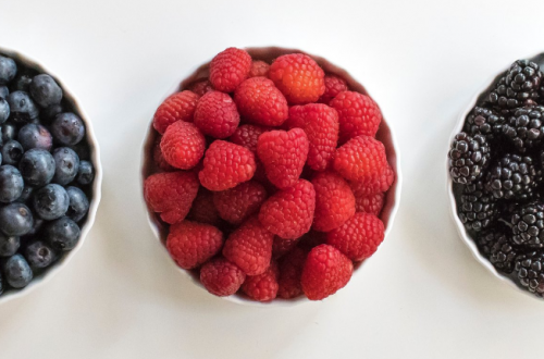 a row of 3 bowls of berries